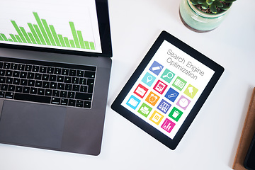 Image showing Seo, tablet and laptop screen with data in top view in office, company or workplace. Computer desk, tech and statistics, graphs and chart for analytics, ui or icons for marketing, advertising or app.