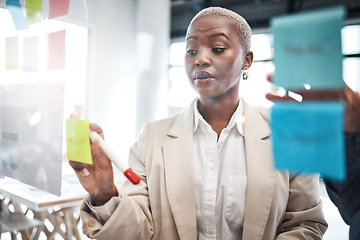 Image showing Black woman, sticky note and schedule planning for brainstorming, teamwork or tasks at the office. African female person or employee working on team strategy, ideas or business agenda at workplace