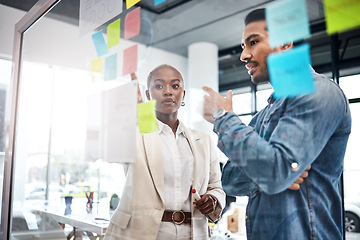 Image showing Creative people, thinking and meeting for schedule planning, brainstorming or team strategy at the office. Man and woman in teamwork decision for project plan, tasks or sticky note ideas in startup