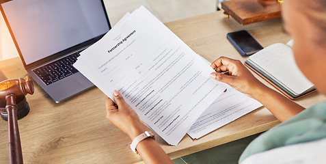 Image showing Contract, document and person hands for law agreement, partnership and hiring or recruitment process at desk. Legal paperwork, information and business people or attorney reading policy and job rules