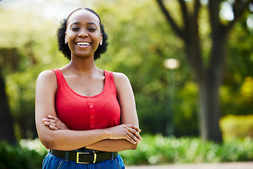 Image showing Portrait, outdoor and black woman with arms crossed, casual outfit or confidence with freedom. Face, female person or girl with happiness, park or cheerful with streetwear, Nigerian or trendy clothes