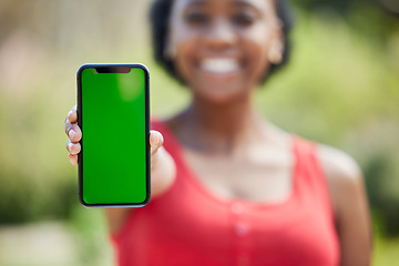 Image showing Woman, hands and phone mockup green screen for advertising, mobile app or communication in nature. Female person show smartphone display or chromakey for advertisement or marketing in the outdoors