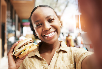 Image showing Burger, portrait and woman in selfie, city and restaurant outdoor promotion, social media and live streaming review. Fast food, happy face and african person or influencer on sidewalk for photography