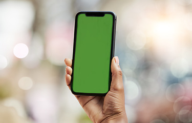 Image showing Smartphone, green screen and person hands in city for social media, advertising and website ui or ux design mockup. Mobile app, technology and people with phone space for outdoor or urban bokeh