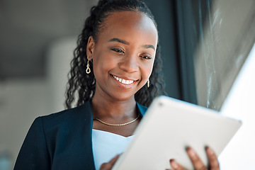 Image showing Happy, lawyer and black woman with tablet in office for legal research, web app and online social media. African attorney, technology and professional reading business email, networking or internet.