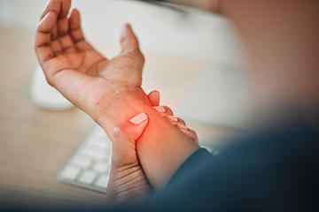 Image showing Hands, business or person with wrist pain while working on a computer in office workplace with red glow or injury. Hurt, carpal tunnel syndrome or closeup of injured worker with discomfort arm cramp