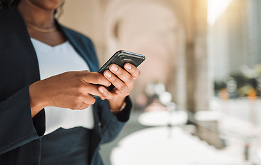 Image showing Woman, hands and phone in city for social media, communication or networking outdoors. Closeup of female person chatting, texting or typing on mobile smartphone app for online browsing in urban town