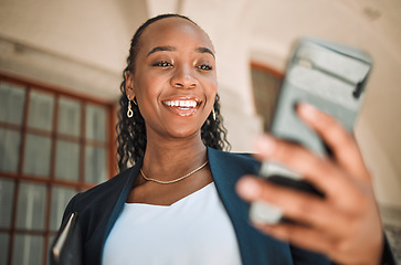 Image showing Phone, commute and a business black woman in the city, searching for directions or typing a message. Mobile, travel and gps with a young female employee looking for a location on a navigation app