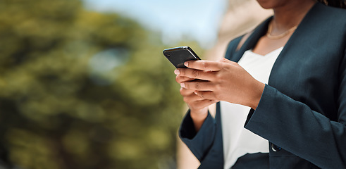 Image showing Woman, hands and phone in city for communication, social media or networking outdoors. Closeup of female person chatting, texting or typing on mobile smartphone app for online browsing in urban town