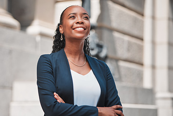 Image showing Arms crossed, happy black woman or lawyer thinking with smile or confidence working in a law firm. Court, empowerment or proud African attorney with leadership, ideas or vision for legal agency