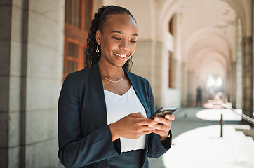 Image showing Phone, travel and a business black woman in the city, searching for directions or typing a message. Mobile, commute and map with a young female employee looking for a location on a navigation app