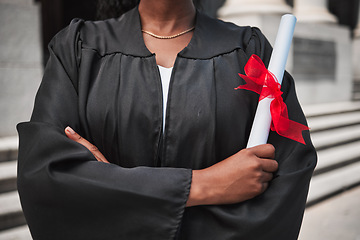 Image showing Education, graduation and certificate with a student arms crossed on campus, confident in her achievement. Diploma, university or college with an african graduate standing outdoor at a ceremony