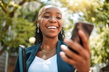 Image showing Happy black woman, phone and city for social media, communication or online browsing at the park. African female person with smile for chatting, texting or networking on mobile smartphone app outside