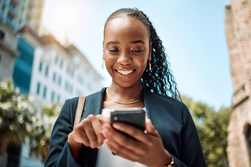 Image showing Phone, walking and a business black woman in the city, searching for directions or typing a message. Mobile, smile and gps with a young female employee looking for a location on a navigation app