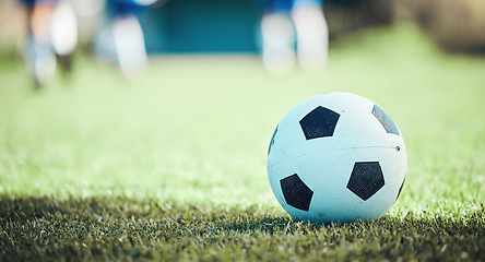 Image showing Field, sports and a football on the grass for a game, goal or training in summer. Fitness, playing and gear for soccer, competition or athlete exercise on the ground for a match or cardio in nature