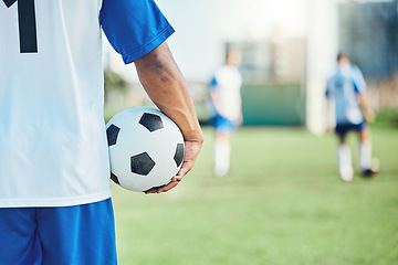 Image showing Back,, sports or man with a soccer ball on a field for exercise, fitness and training outdoors. Football club, ready or healthy athlete in a game for competition event or match contest in stadium