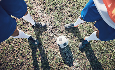 Image showing Legs, soccer and ball with a team ready for kickoff on a sports field during a competitive game from above. Football, fitness and teamwork on grass with players standing on grass to start of a match