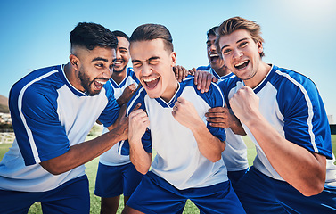 Image showing Football player, game and men celebrate together on a field for sports and fitness win. Happy male soccer team or athlete group with fist for challenge, competition or achievement outdoor on pitch