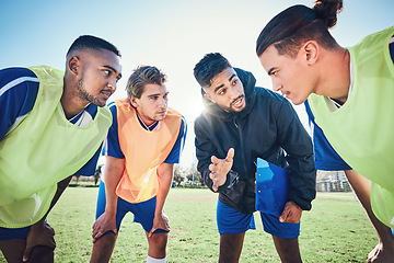 Image showing Soccer player, team talk and coach on field for tactics, sport and listen together for training, advice or fitness. Athlete men, group and mentor on pitch for exercise, football or teamwork in summer