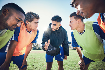 Image showing Coaching, football circle and people talking for sports teamwork, competition strategy and game on field. Listening, speaking and man, soccer player team or group motivation, goals or training advice