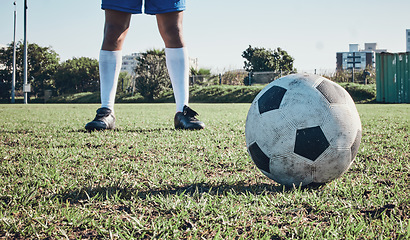 Image showing Sports, soccer ball and feet or shoes of person to kick on field, fitness training or ready for a goal on grass. Football, sneakers and athlete in exercise, competition or sport challenge for goals