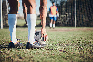 Image showing Soccer ball, sports and feet of person to kick on field, fitness training or shoot for a goal in the net. Football, player and legs of athlete in exercise, competition or sport challenge for goals