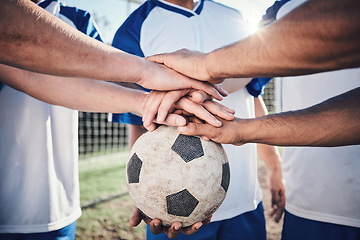 Image showing Football, hands together and collaboration for support, sports and training at stadium. Teamwork, group huddle and soccer players with motivation for exercise, workout goal and success in competition