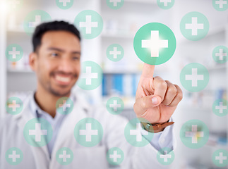 Image showing Pharmacist man, hand and health with hologram cross, happy and choice with futuristic 3d overlay in store. Young pharmacy manager, icon and smile for healthcare, wellness and decision for drugs on ux