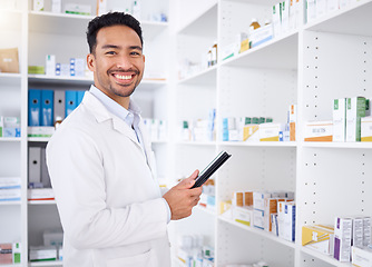 Image showing Man, portrait and pharmacist with tablet in pharmacy, drugstore or shop. Face, technology and Asian medical professional, happy doctor or worker with a pharmaceutical job for healthcare in Cambodia