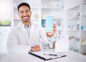 Image showing Happy man, portrait and pharmacist with phone screen in pharmacy, drugstore or shop. Face, smartphone and medical professional with mockup space for healthcare promotion, advertising and marketing.