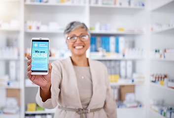 Image showing Pharmacy, contact and mobile for medical with doctor in closeup with internet or blurr background. Pharmacist, woman and hand with phone screen for online in portrait at drugstore with feedback.