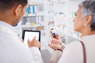 Image showing Pharmacist, typing and tablet with customer, medicine and question with discussion for product info. Man, senior patient and pills with digital touchscreen for mockup, shopping or helping in pharmacy