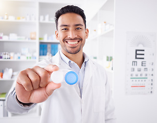 Image showing Happy asian man, doctor and contact lenses at pharmacy for sight, vision or healthcare solution at store. Portrait of male person, pharmacist or medical professional smile with eye case at the clinic