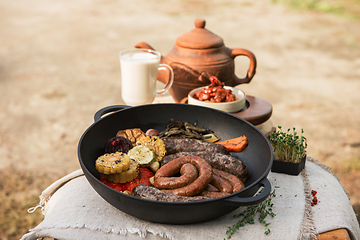 Image showing Grilled sausages with vegetables