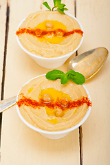 Image showing Hummus with mint on top