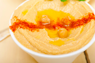 Image showing Hummus with mint on top