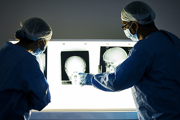 Image showing Dentist team, teeth x ray and together for analysis, study and learning in clinic for healthcare. Surgeon group, monitor skull and tooth growth for wellness, care or point with discussion in hospital