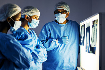 Image showing Dentist team, teeth x ray and monitor for analysis, study and learning in clinic for healthcare. Surgeon group, skull and jaw with tooth growth for wellness, care or focus with discussion in hospital