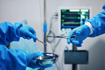 Image showing Surgery, scissors in hands and doctor with nurse, health and medical procedure, metal equipment and operating room. Healthcare, people in hospital and surgeon with treatment, tools and closeup