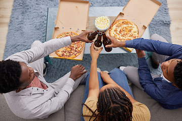 Image showing Cheers, beer and above of people with pizza, lunch celebration and relax together in a house. Happy, dinner and friends toasting with alcohol and food on the living room sofa to celebrate eating