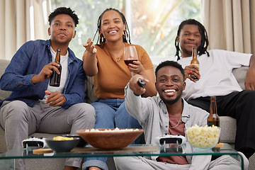 Image showing Relax, television and friends on a sofa with beer and popcorn for movie, film or streaming in their home. Group of people, watching tv and smile in living room together with entertainment on weekend