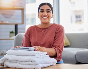 Image showing Cleaning, smile and laundry with portrait of woman in living room for housekeeping service, clothes and fabric. Hospitality, happy and cleaner with person at home for maintenance and washing