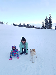 Image showing Happy young mother with daughter in the winter park with dog.