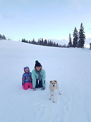 Image showing Happy young mother with daughter in the winter park with dog.