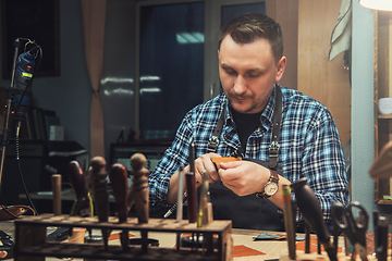 Image showing Concept of handmade craft production of leather goods.