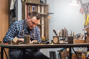 Image showing Concept of handmade craft production of leather goods.