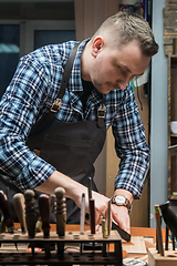 Image showing Concept of handmade craft production of leather goods.