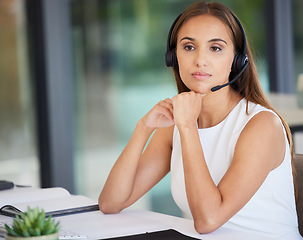 Image showing Call center, serious woman and thinking in office of customer service, CRM solution and telecom ideas. Female agent focus with microphone for telemarketing, sales consulting and support at help desk