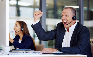 Image showing Winner, motivation and a senior man in a call center for success in customer service or support. Wow, deal or sale with a happy mature male consultant in celebration at his crm office desk at work