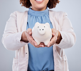 Image showing Hands of woman with piggy bank, savings in studio and finance and budget planning with investment loan. Financial freedom, growth and profit, salary management girl with money box on white background